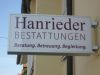 Hanrieder Bestattung in München weißer Leuchtkasten mit Schrift, Neon Beleuchtung in München